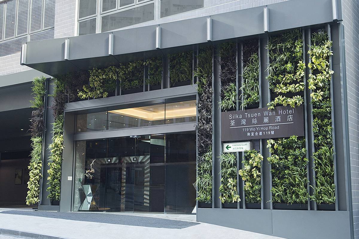 Main Entrance: A green wall is planted with different types of plants