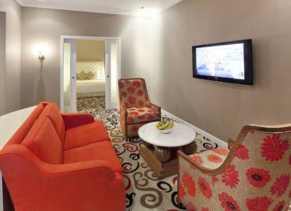 Silka Suite Living Hall: Modern and vibrant coloured furniture will brighten up your stay