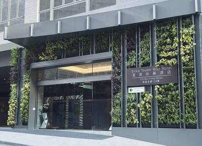 Main Entrance: A green wall is planted with different types of plants