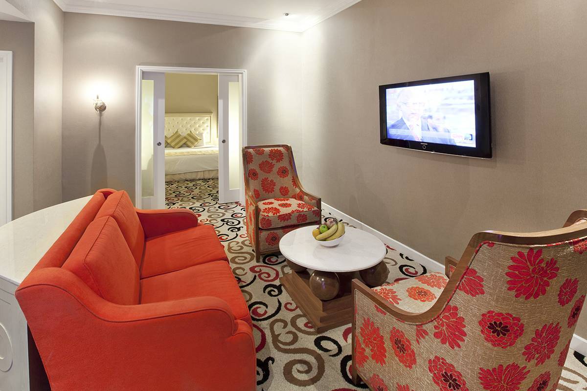 Silka Suite Living Hall: Modern and vibrant coloured furniture will brighten up your stay